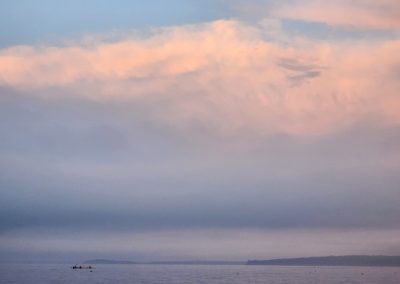 2023-12-12 Kayaking at Sunset, photographed in August by Lisa Bartusek in Bayside, ME. #kayak #sunset #bigsky #accumulatingclouds #penobscotbay #baysidemaine