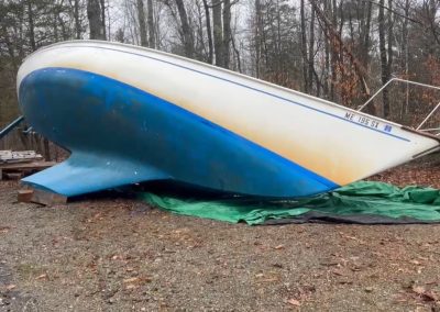 2023-12-30 Heeling, photographed and written by David Leaming. Twas a week before Christmas, As outside winds blew twice that of a gale. Power was out, likely for days now. This could be another Maine weather tale. Went out to shut off the generator and head back to warm house and bed. I figured all would be good; I’m prepared and I hadn’t anything to dread. In the dark, I gave a quick gander at my 30-foot sailboat, Flyaway. Looked sturdy and upright as strong winds failed to make it shudder or sway. Next morning I was up at dawn and came out to restore my own power. I looked over at Flyaway and was shocked to see it flat as a pancake. My jaw dropped even at that early hour. Sometime in the night, the winds must have gotten her rocking. Came down softly with tarps and framing intact from what I can see, like nudging up in kind seas when people are gawking you as you’re docking. Depression set in as I drove to Belmont Boatworks later in the day. Wanted to see if the crane truck was available, hoist her back up on boat stands, and make this boat owner less sour and maybe a bit more happy and gay. I hope Flyaway is restored upright in the first week of the new year. Power is back on here, and a couple of shingles blew off, but I don’t want to look in the rear. Consider yourself lucky if all you lost were a couple of tree limbs, power or things that tend to fall. If it weren’t for bad luck, I’d have no luck at all. #poetry #fallingover #winddamage #boatsfallingover #stormdamage #sailboat #poemoftheday #baysidemaine