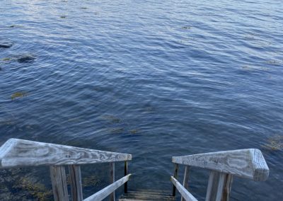 2025-04-01 Stairs to the Sea, photographed from a Bay Street cottage in Bayside, ME by Amity Hall. #stairstothesea #beachstairs #takeadip #steponin #awalkonthebeach #penobscotbay #baysidemaine