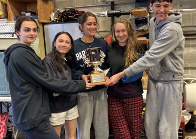 2025-05-23 Sailing to Victory, submitted by Alma Bewsher. The Islesboro Sailing Team won the State Championship Regatta last weekend, which was hosted at Maine Maritime Academy. There were 11 schools from all over Maine participating. Islesboro finished 1st in A fleet, and, with a combined score from both of their A and B fleet boats, they took home the Maine Schools Sailing Association Championship Trophy. Congratulation, Sailors! Pictured from left to right are Sophia Skrivanich, Baysider Eloise Mooney, Baysider Alma Bewsher, Rosie Brimley and Caleb Read. #sailing #highschoolsailing #islesborocentralschool #youngsailors #statechamps #baysidemaine