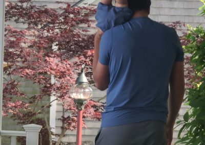 2025-06-28 Head Over Heels for Bayside, photographed by Dan Webster IV and featuring Dan Webster V and Tommy (a/k/a Dan Webster VI) during Tommy’s first visit to Bayside, ME. “He’s loving it.” #headoverheels #threegenerations #newgrandson #fatherandson #firsttimevisitor #familyhome #baysidemaine