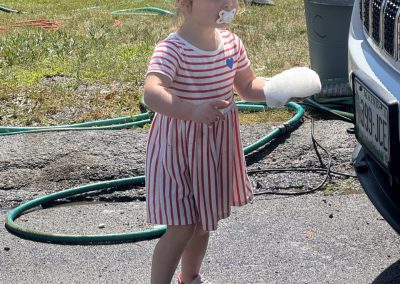 2025-07-21 Child Labor, photographed by Bill Cressey in Bayside, ME and featuring Charleigh Bellemare. Her dad, Jon, brought his truck to the Northport Junior Yacht Club Car Wash fundraiser on Saturday, and Charleigh got to work! @nyc_bayside #childlabor #carwash #gettingsoapy #chippingin #fundraiser #junioryachtclub #rugglespark #baysidemaine