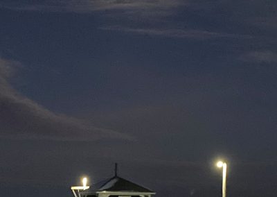 2025-12-05 Winter Wharf, photographed Wednesday afternoon (yes, afternoon, about 4:30) at the Bayside, ME wharf by Carol Kuhn after the season’s first snowfall. “The snow is really pretty, and everyone is smiling. Maybe we will have a white Christmas!” #firstsnowfall #firstsnow #moonlight #thewharf #penobscotbay #baysidemaine